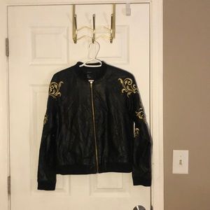 Forever 21 leather jacket with gold design on each sleeve.